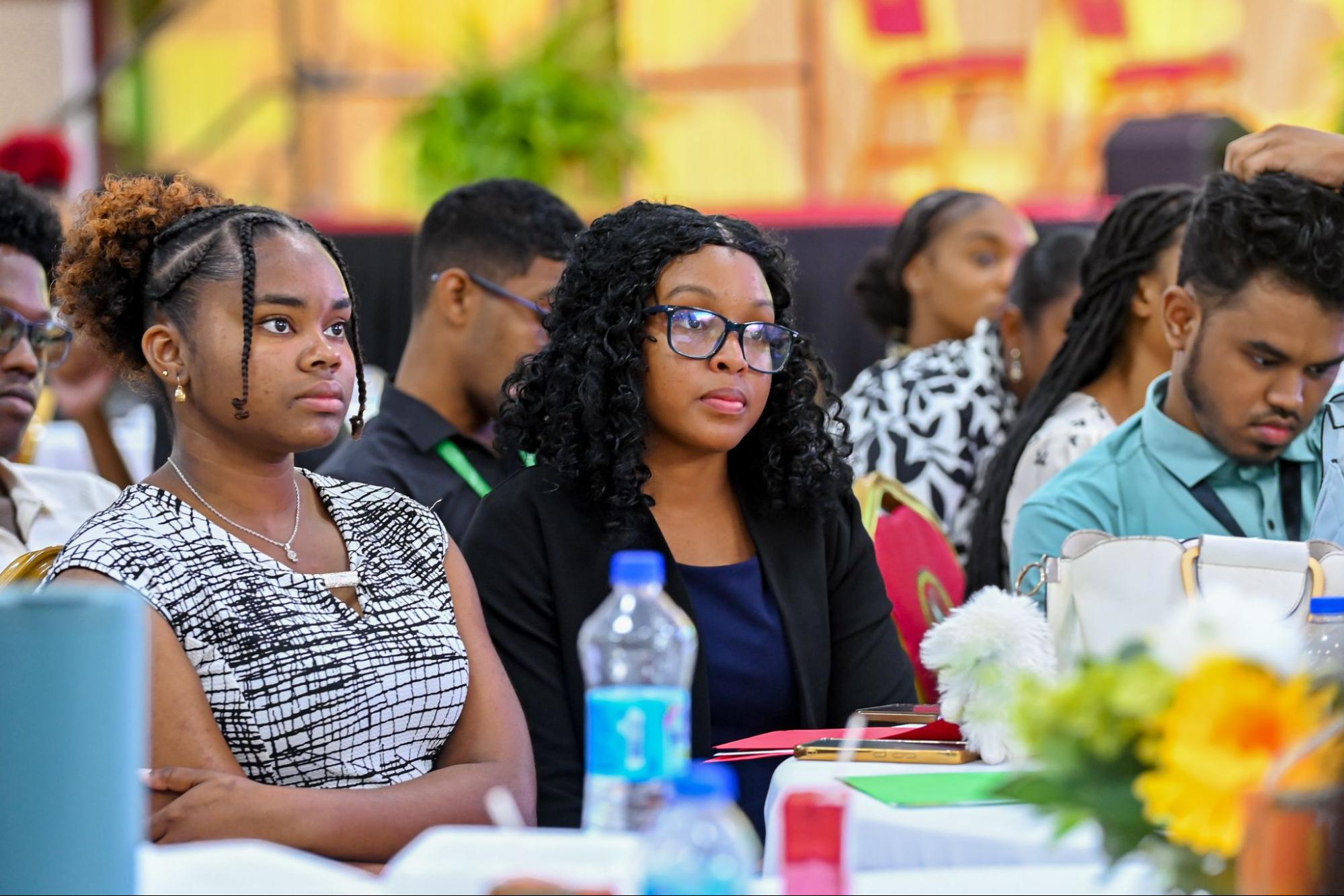Attentive USC students listen closely to speakers during the Business Seminar Day presentations in the auditorium
