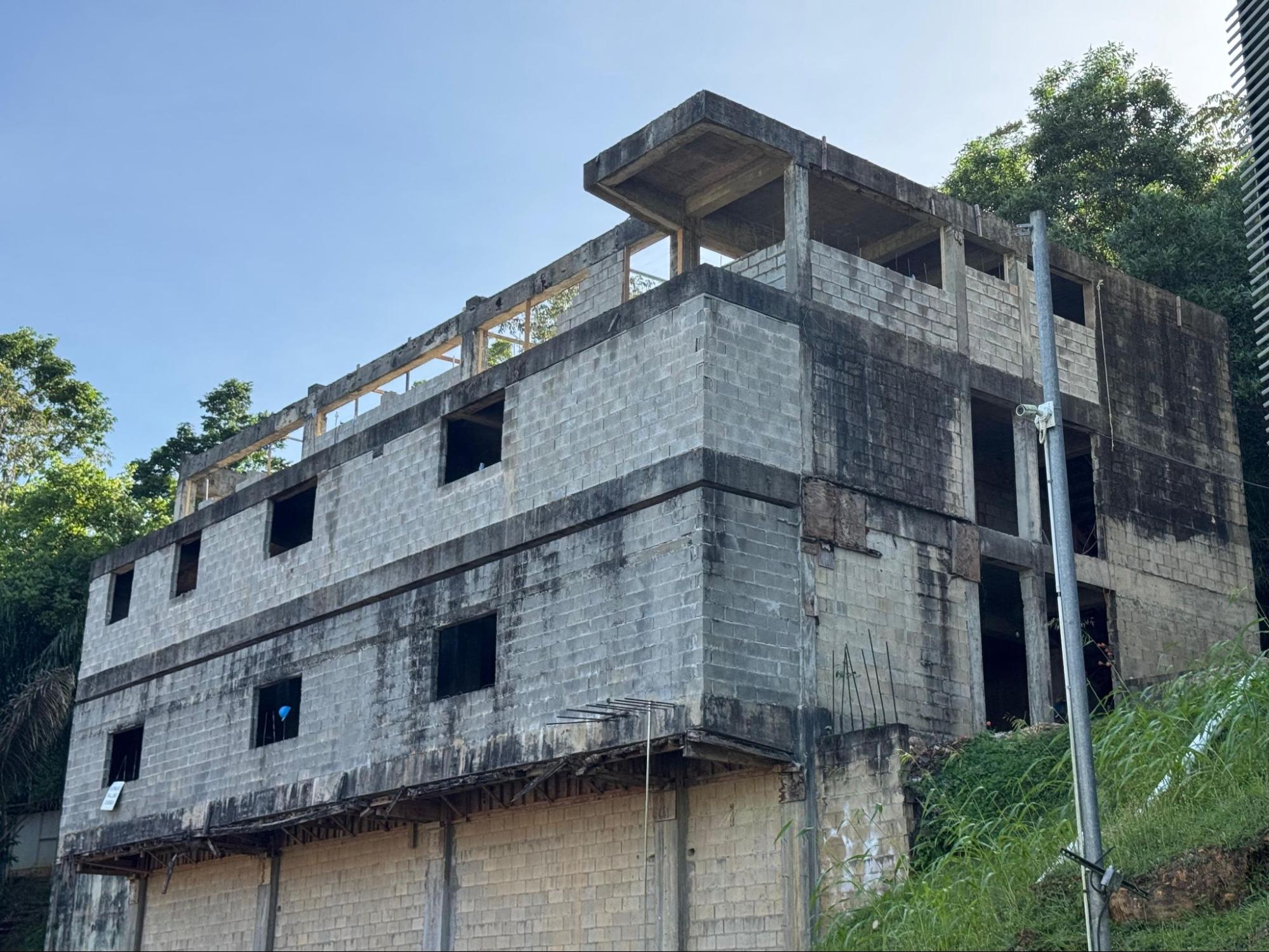 Exterior view of the multi-storey concrete structure of the USC Ladies Residence Hall under construction