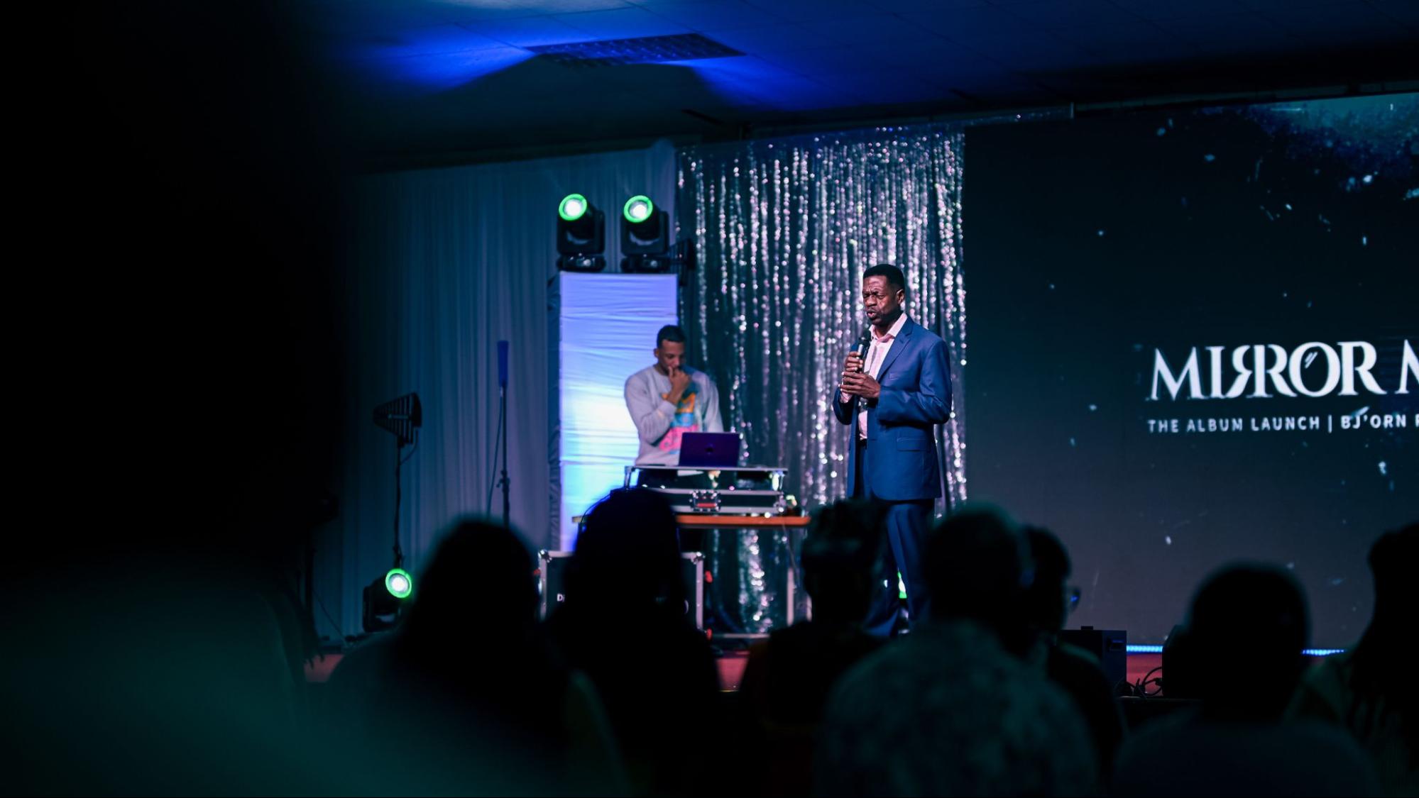 USC President Dr. Colwick Wilson praying at Mirror Man 2 Launch