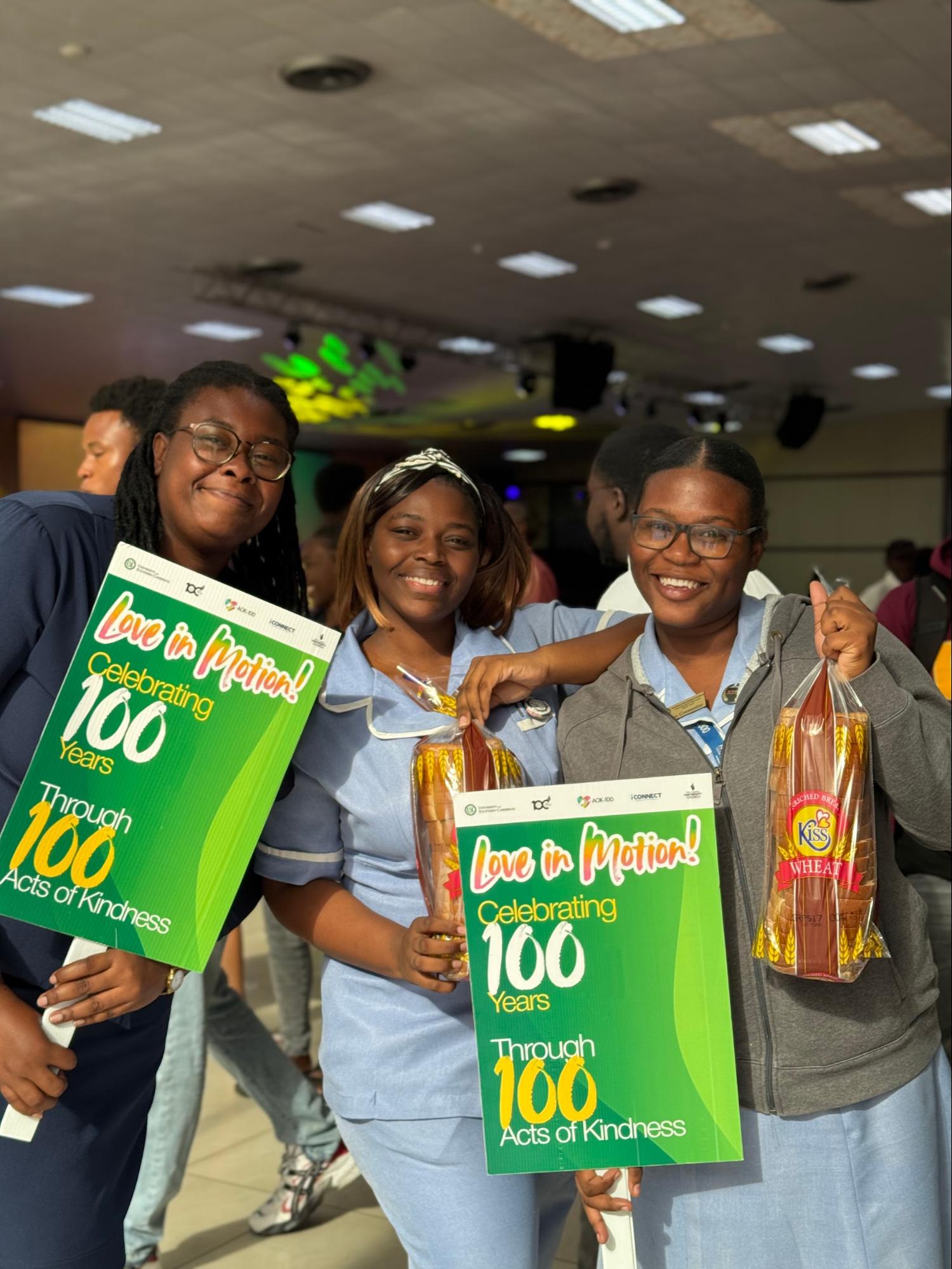 Student leaders from the University of the Southern Caribbean Associated Student Body actively distributing bread to the local community at Pulse.