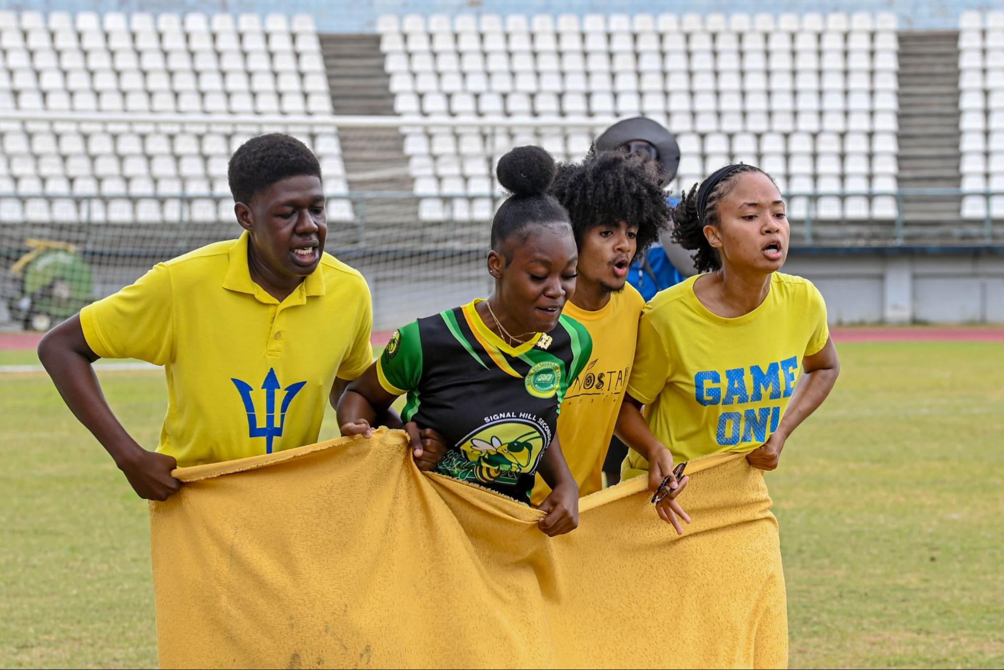 Students from Sci-Tech competing in a group sack race