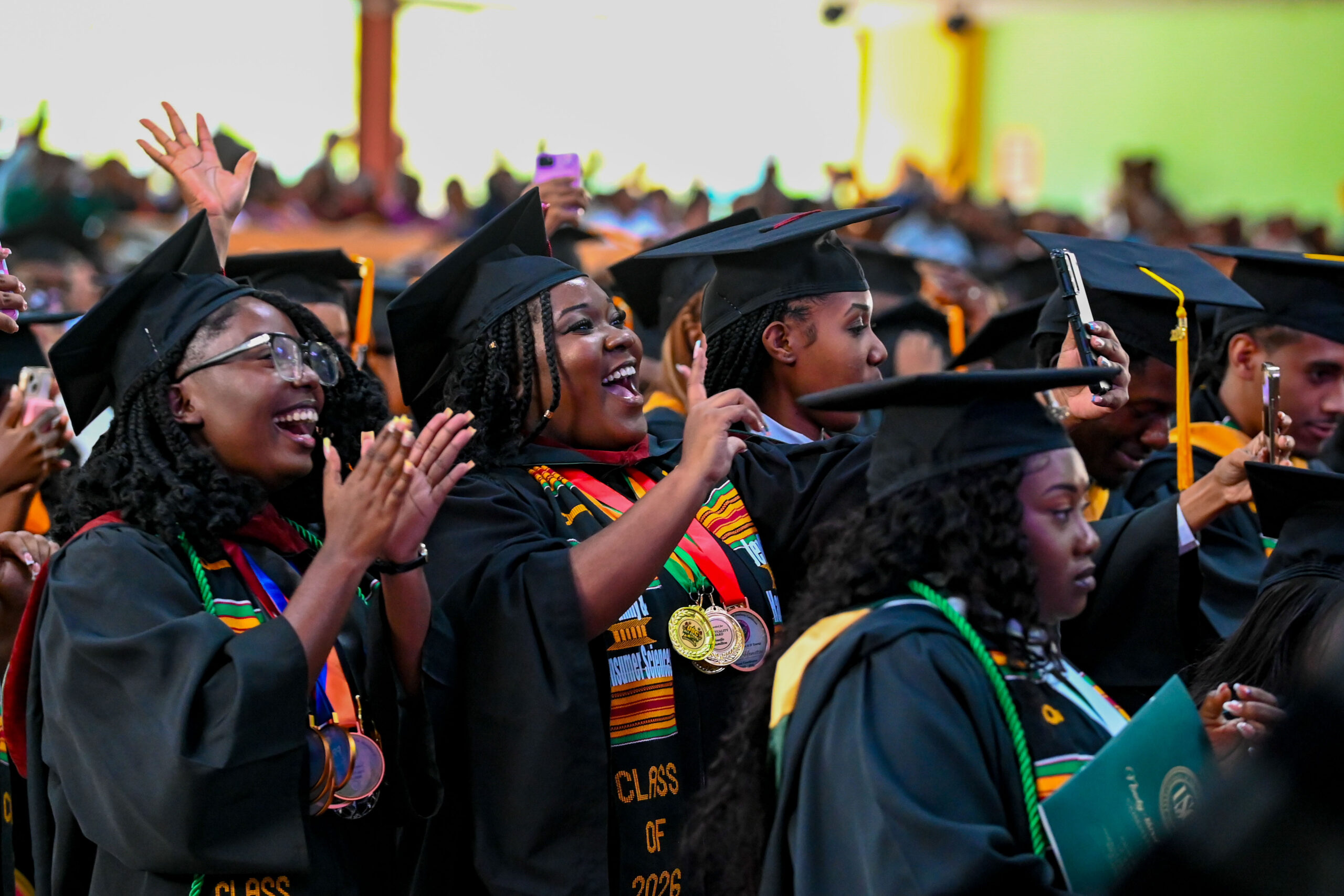 USC graduates cheering and waving during the 93rd Commencement Ceremony celebration.